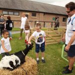 Children with some of the animals from the petting farm.