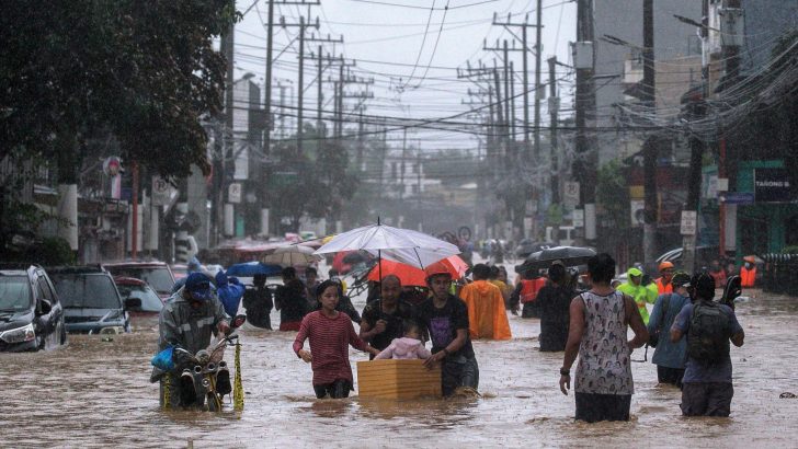 Fifth storm in three weeks leaves Filipinos trapped in houses, on roofs